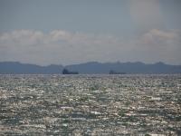 Barcos en Punta Búrica - vista desde la playa en Estero Rico